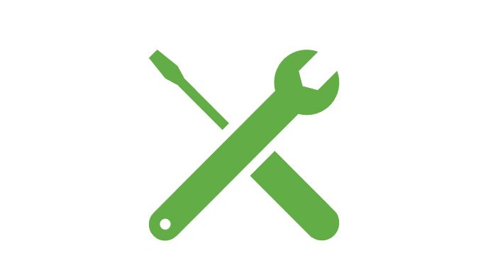 Green screwdriver and wrench intersecting each other